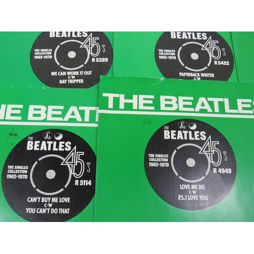 299 - Boxed Collection of 24 Vinyl 45's Beatles records with collectors box. All in sleeves and appear to ... 