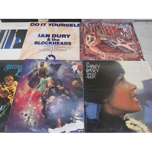 304 - Fifteen Vinyl Rock and Pop LP' Albums by various artists to include, Ziggy Merley, Tracy Chapman, Ia... 