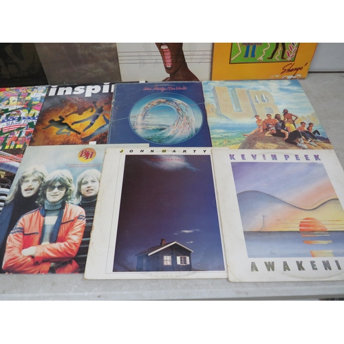 305 - Fifteen Vinyl Rock and Pop LP' Albums by various artists to include, Santana, UB40, Grace Jones, Hap... 