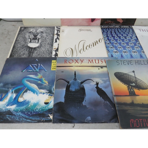 309 - Fifteen Vinyl Rock and Pop LP' Albums by various artists to include, Super Tramp, Santana, Jean Mich... 