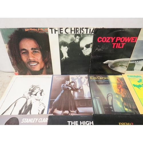 310 - Fifteen Vinyl Rock and Pop LP' Albums by various artists to include,  Sting, Bob Marley, Cozy Powell... 