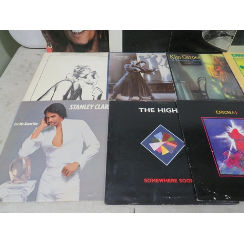 310 - Fifteen Vinyl Rock and Pop LP' Albums by various artists to include,  Sting, Bob Marley, Cozy Powell... 