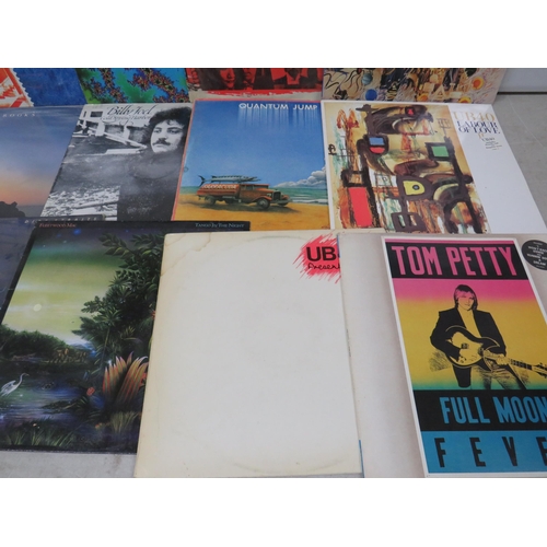 311 - Fifteen Vinyl Rock and Pop LP' Albums by various artists to include, UB40, Dire Straights, Police, T... 