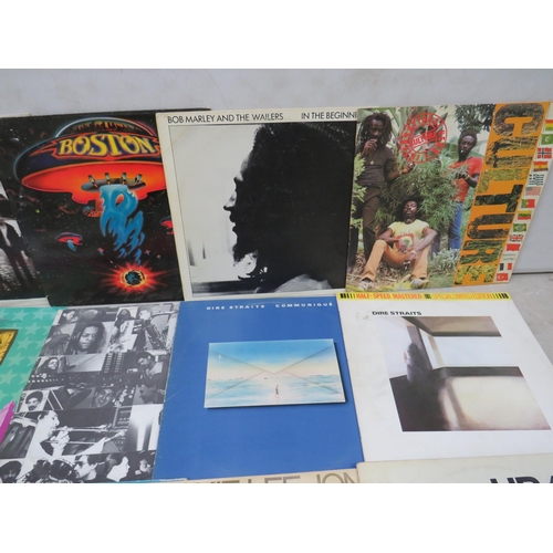 316 - Fifteen Vinyl Rock and Pop LP' Albums by various artists to include, Bob Marley, Deacon Blue, Talk T... 