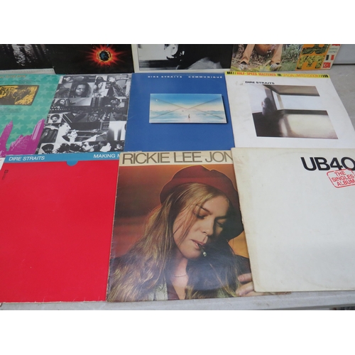 316 - Fifteen Vinyl Rock and Pop LP' Albums by various artists to include, Bob Marley, Deacon Blue, Talk T... 