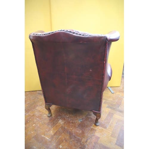 924 - Beautifully Upholstered Leather Chesterfield Wing back Chair in very good condition, see photos