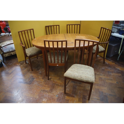 926 - Mid 20th Century, Mc'intosh Teak Extending Dining Table with six chairs ,  Some slight marking to ta... 