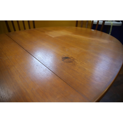 926 - Mid 20th Century, Mc'intosh Teak Extending Dining Table with six chairs ,  Some slight marking to ta... 