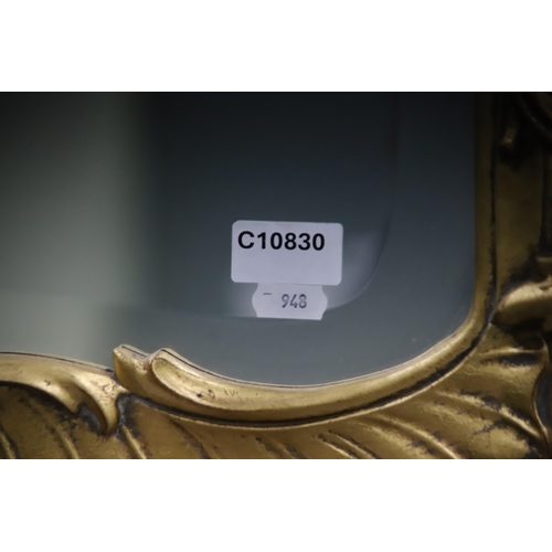 948 - Large modern Ornate mirror in the French style with gilded frame and bevelled glass. Measures approx... 