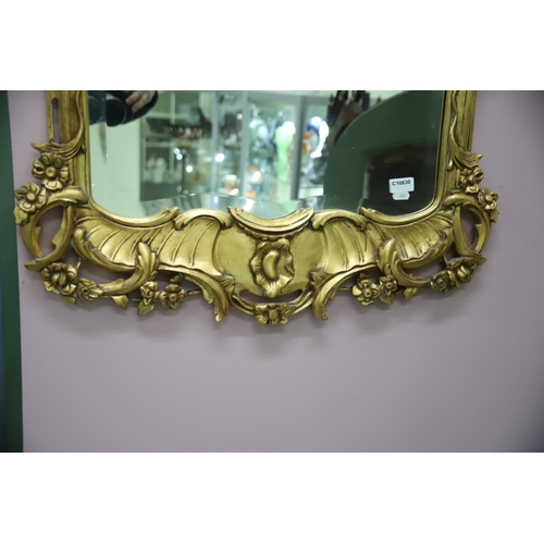 949 - Large modern Ornate mirror in the French style with gilded frame and bevelled glass. Measures approx... 