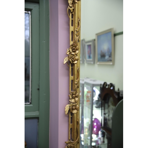 949 - Large modern Ornate mirror in the French style with gilded frame and bevelled glass. Measures approx... 