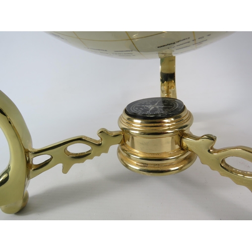 554 - World globe in brass gimbal with compass and set with semi precious stones, 14.5