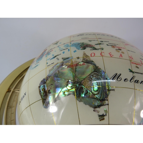 554 - World globe in brass gimbal with compass and set with semi precious stones, 14.5