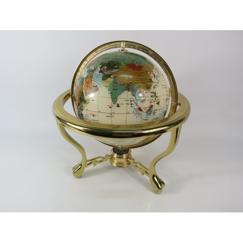 554 - World globe in brass gimbal with compass and set with semi precious stones, 14.5