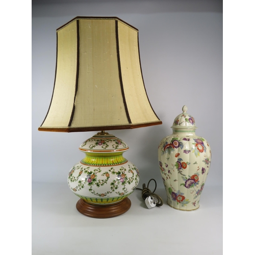 560 - Large Faience style table lamp with shade plus a large German lidded jar (repair to finial). The lam... 