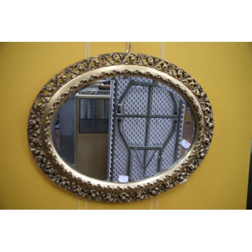 976 - Oval ornate framed mirror which measures 24 x 30 inches plus approx plus four small framed prints.  ... 