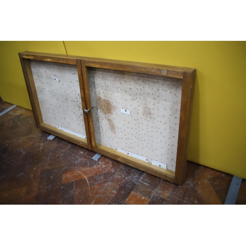 986 - Well made Oak Display cabinet with twin doors.  Measures approx 22 x 45 x 2.5  inches. In very good ... 