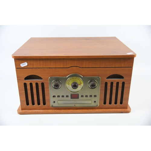 2021 - Retro style Music Centre by Akurua which appears to be in Working order H:10 x W:18 x D:14 inches.  ... 