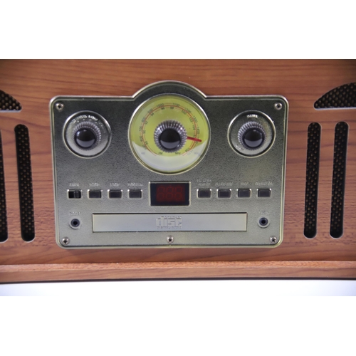 2021 - Retro style Music Centre by Akurua which appears to be in Working order H:10 x W:18 x D:14 inches.  ... 