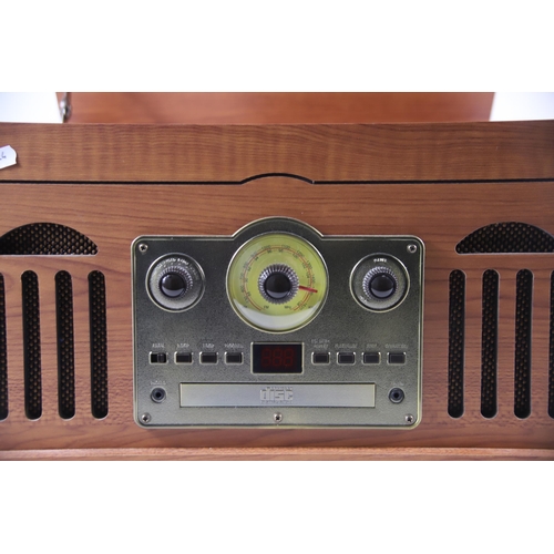 2021 - Retro style Music Centre by Akurua which appears to be in Working order H:10 x W:18 x D:14 inches.  ... 