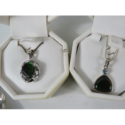 379 - Two Sterling silver Ammolite pendants with chains plus a sterling silver spoon & locket plus some co... 