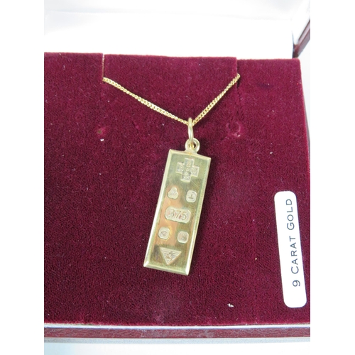 382 - 9ct Gold Millennium Ingot pendant with a 9ct gold 18