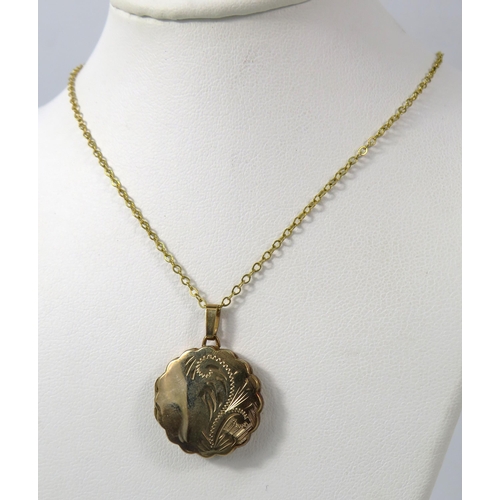 383 - 9ct Gold scroll engraved locket on a 19