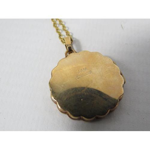 383 - 9ct Gold scroll engraved locket on a 19