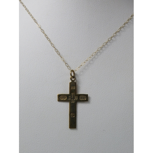 384 - 9ct Gold Millennium Crucifix pendant on a 18