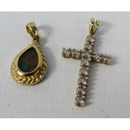 385 - 10ct Gold Crucifix pendant set with 12 small diamonds & a 14ct gold Ammoilte set pendant. Total weig... 