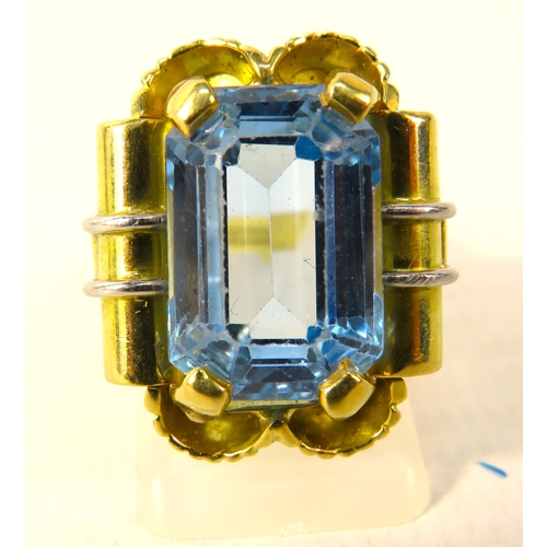 390 - 18ct Gold Statement ring set with a blue topaz 16mm by 10mm, finger size O. 15.7 grams