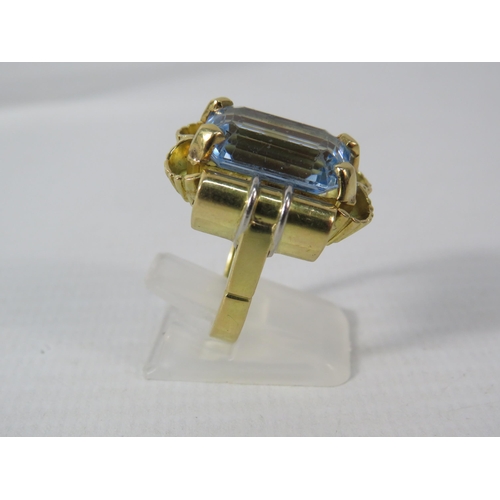 390 - 18ct Gold Statement ring set with a blue topaz 16mm by 10mm, finger size O. 15.7 grams