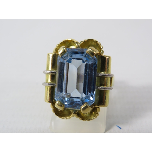 390 - 18ct Gold Statement ring set with a blue topaz 16mm by 10mm, finger size O. 15.7 grams