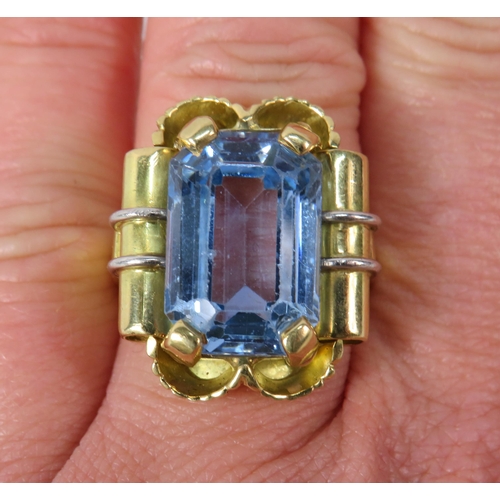 390 - 18ct Gold Statement ring set with a blue topaz 16mm by 10mm, finger size O. 15.7 grams