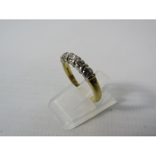 391 - 18ct Gold ring set with five 3mm diamonds, finger size M, 3.3 grams.