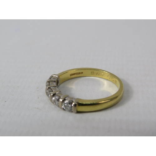 391 - 18ct Gold ring set with five 3mm diamonds, finger size M, 3.3 grams.