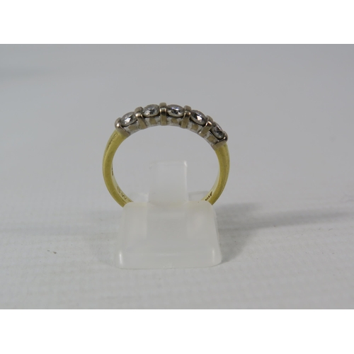 391 - 18ct Gold ring set with five 3mm diamonds, finger size M, 3.3 grams.