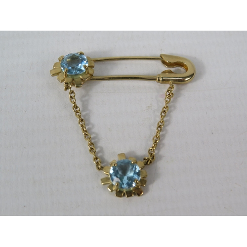 392 - 9ct Yellow Gold Safety Pin styled brooch set with two 6mm Topaz.  Total Weight 4.4g