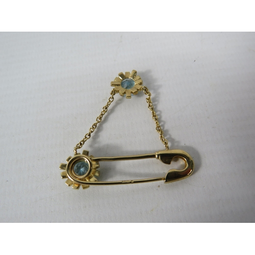 392 - 9ct Yellow Gold Safety Pin styled brooch set with two 6mm Topaz.  Total Weight 4.4g