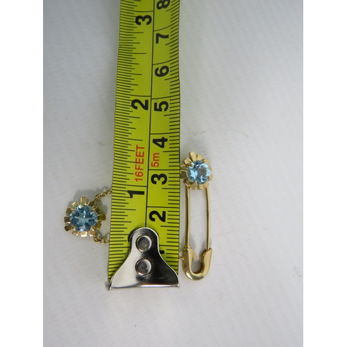 392 - 9ct Yellow Gold Safety Pin styled brooch set with two 6mm Topaz.  Total Weight 4.4g