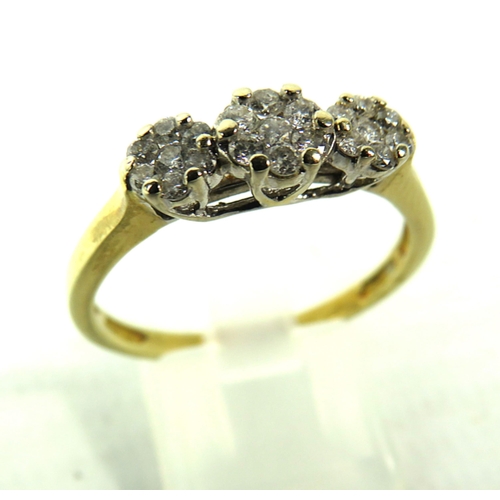 393 - 9ct Gold ring with 21 diamonds set in flower pattern, finger size V, 4.1 grams. (Hallmarks rubbed)