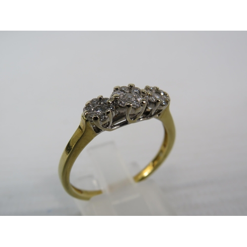 393 - 9ct Gold ring with 21 diamonds set in flower pattern, finger size V, 4.1 grams. (Hallmarks rubbed)