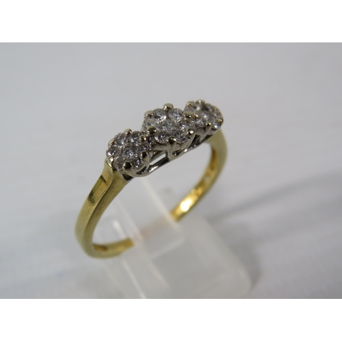 393 - 9ct Gold ring with 21 diamonds set in flower pattern, finger size V, 4.1 grams. (Hallmarks rubbed)