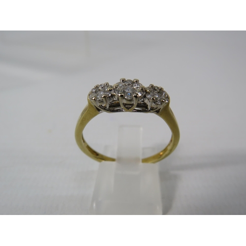 393 - 9ct Gold ring with 21 diamonds set in flower pattern, finger size V, 4.1 grams. (Hallmarks rubbed)