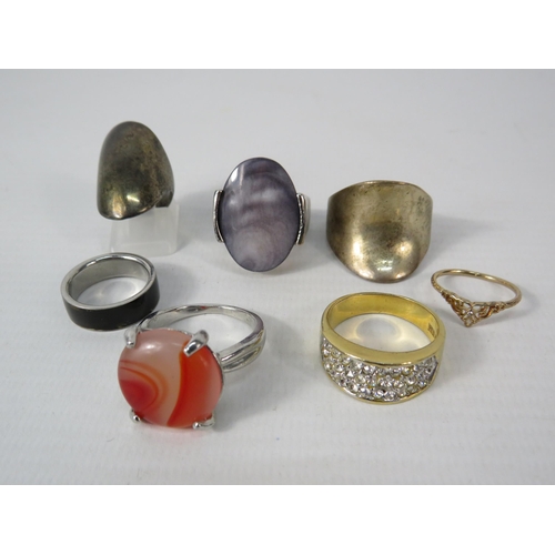 394 - Seven costume Jewellery statement rings.