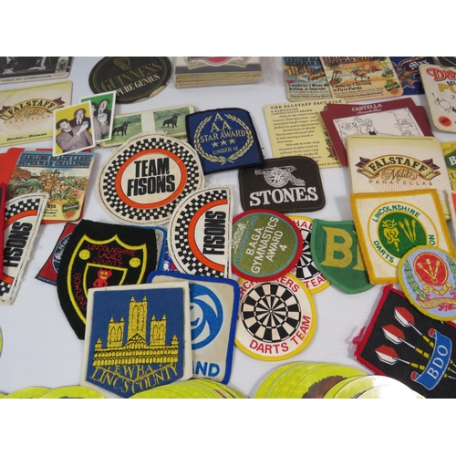 588 - Mixed lot to include Vintage beer mats, 1986 Madballs stickers, Material Patches etc.