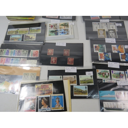 593 - Over 100 set of mainly mint stamps sets &  a large selection of unused postcards and Kensitas Cigare... 