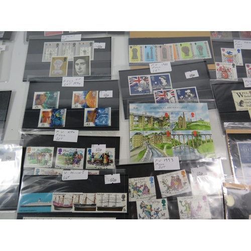 593 - Over 100 set of mainly mint stamps sets &  a large selection of unused postcards and Kensitas Cigare... 