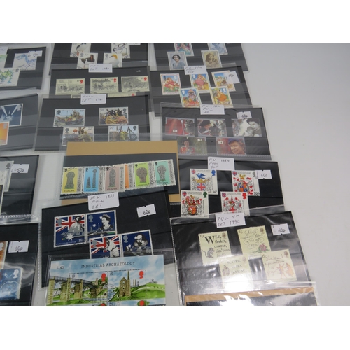 593 - Over 100 set of mainly mint stamps sets &  a large selection of unused postcards and Kensitas Cigare... 