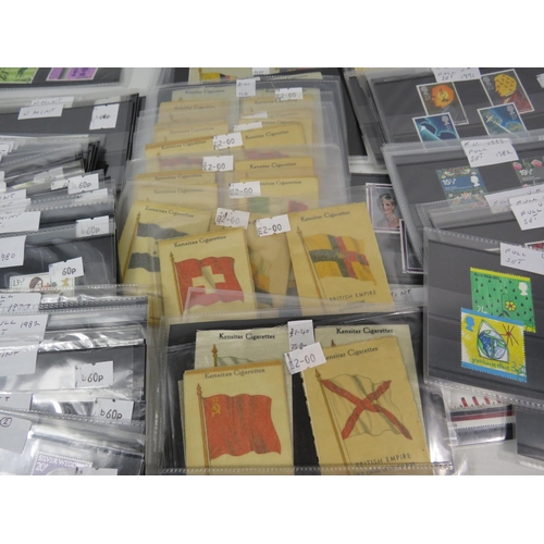 593 - Over 100 set of mainly mint stamps sets &  a large selection of unused postcards and Kensitas Cigare... 